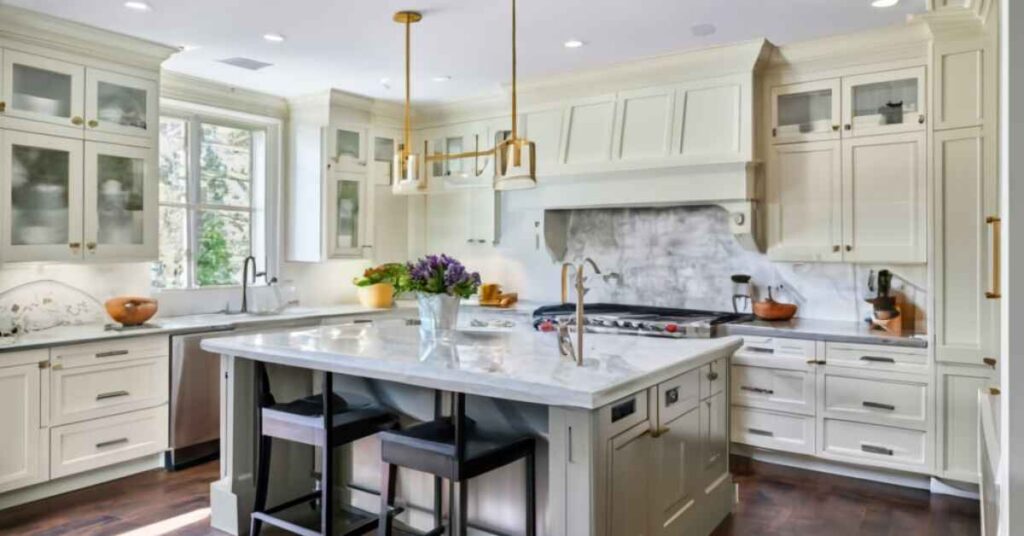 Cream kitchen cabinets with dark countertops