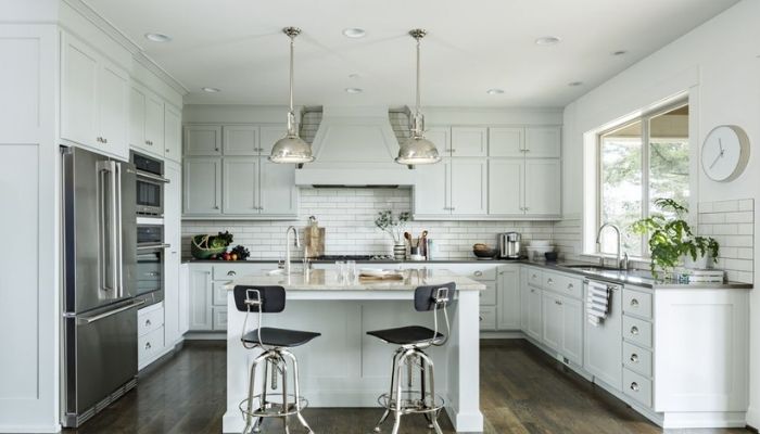 Light grey kitchen cabinets with white cabinets