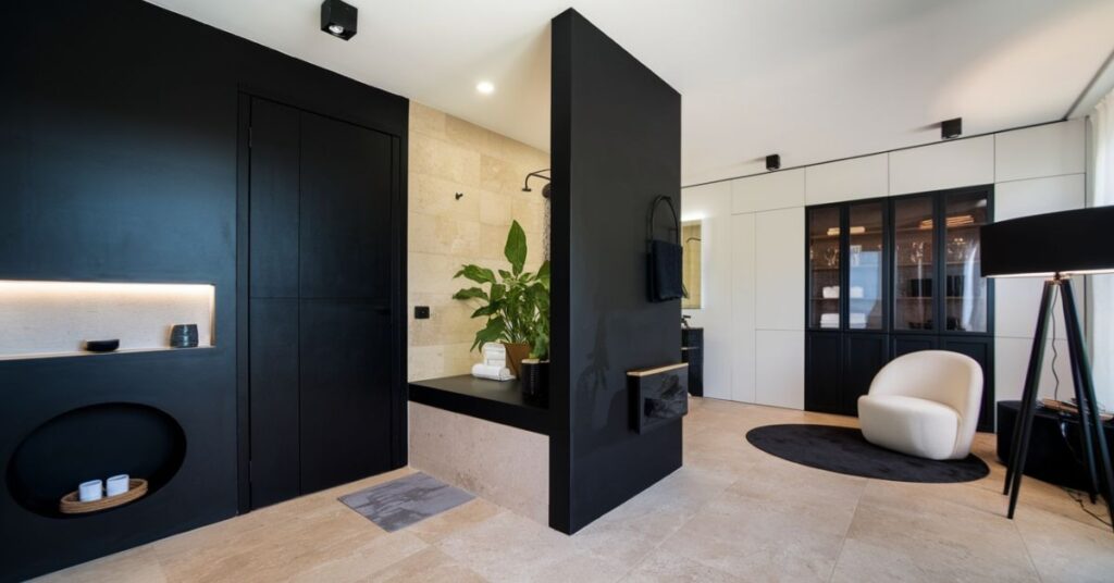 Modern Bathroom Design with Black Accents Reminiscent of a Living Space 