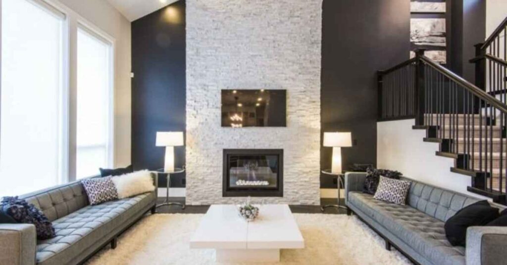 Contemporary Den Featuring a Large Fireplace